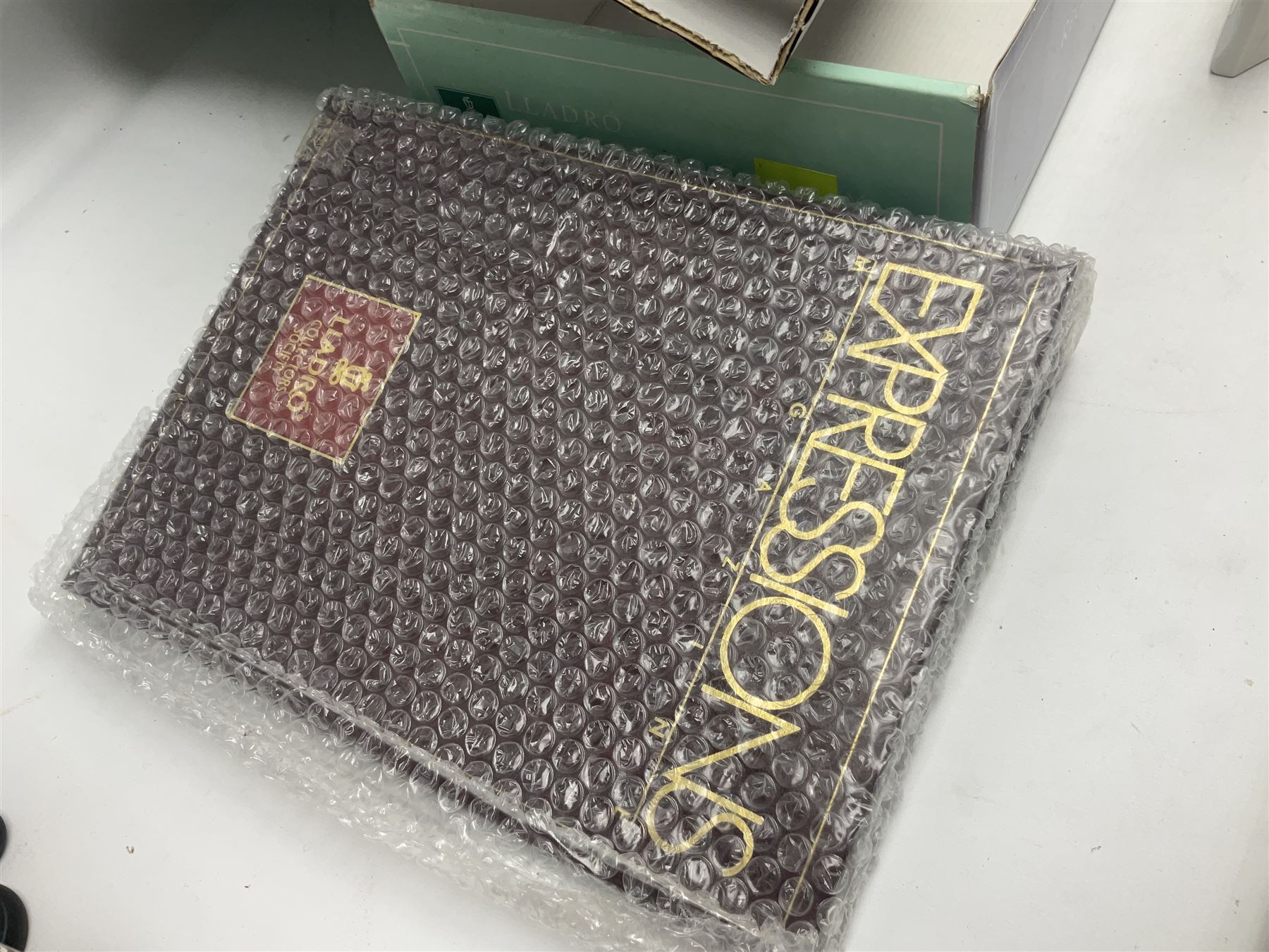 Seven Lladro flowers, comprising Japanese Camelia on base no 5181, Yellow Begonia on base no 5186, Miniature Begonia on base no 5188, Chrysanthemum on base no 5189, California Poppy no 5190.B, Miniature Begonia 5188.B and White Carnation no 5184.B, together with Lladro Spanish Joining pack with 17616 Winter Bell, Additional Lladro parasols and flowers etc 