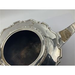 1920s five-piece silver tea service, comprising teapot, coffee pot, hot water pot, twin handled open sucrier and milk jug, each of squat circular form with shaped rim, the teapot, coffee pot and hot water pot each with ebonised handle and finial, the sucrier and milk jug with acanthus capped scroll handles, all upon circular foot, hallmarked R F Mosley & Co, Sheffield 1926 & 1927, tallest H24cm
