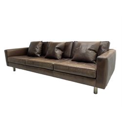 Ralph Lauren - three seat sofa, upholstered in buttoned brown leather with additional cushions, on turned brushed metal feet