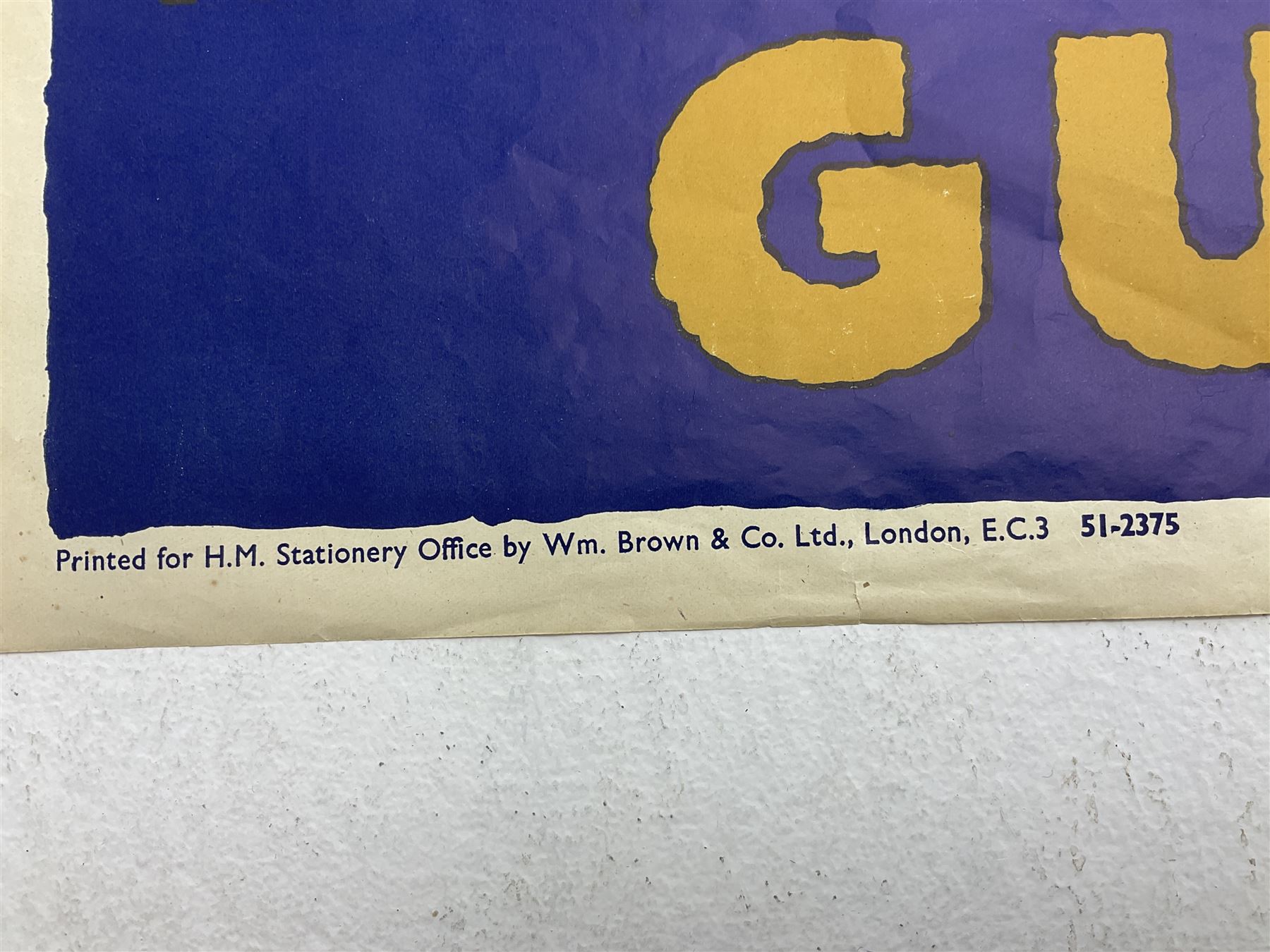 WW2 poster after Alfred Sindall printed for H.M. Stationery Office by Wm. Brown & Co Ltd London E.C.3; poster No.S.P.37 'Paper For Salvage Helps To Feed The Guns' depicting British Soldiers firing a field gun 75 x 51cm; blue, gold and white; unframed
