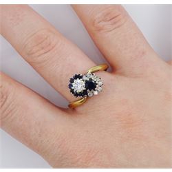 18ct gold round brilliant cut diamond and sapphire crossover ring, London 1975, total diamond weight approx 0.30 carat