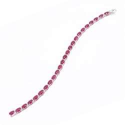 18ct white gold ruby and diamond bracelet, twenty-six oval cut rubies, each spaced by two ...