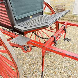 Holland & Holland Tandem Cart - Althorp Spencer Family Estate

A two wheeled tandem cart or cocking cart by Holland & Holland Coach Builders, London, with black painted bodywork, red painted shafts and running gear, red wooden spoked wheels with rubber tyres, green upholstered seating and a rear perforated metal footboard. The cart is fitted with carriage lamp brackets (lamps next lot), green buttoned cushions with leather retaining straps, side louvered body panels, footrests, leaf spring suspension and shafts for horse use. The carriage incorporates an adjustable body position, operated by a lever, allowing the body to be moved forwards or backwards to alter the weight distribution. Formerly owned by the family of Lady Diana Spencer,
Sympathetically conserved by Woods of Fairbourne Carriages Ltd, Kent.

Features:
• Brass maker’s plaque for Holland & Holland Coach Builders, London
• Two wheeled tandem cart
• Black painted body with red painted shafts and running gear
• Red wooden spoked wheels with rubber tyres
• Green upholstered cushions with leather retaining straps
• Adjustable carriage body for weight distribution
• Lever operated adjustment mechanism
• Perforated rear footboard
• Side footrests
• Louvered side panels
• Leaf spring suspension
• Rear opening storage compartment
• Decorative painted armorial motif to rear panel
• Fitted carriage lamps shown, not included in the lot (available as next lot)
• Conserved by Fairbourne Carriages Ltd
• Provenance: The Althorp Attic Sale including The Spencer Carriages, lot 195, 7 July 2010

Dimensions:
Overall length 396 / 198cm
Width 155cm
Height 190cm

Wheel Diameters:
Wheels: 148cm

Seating:
Driving seats: 2
Passenger seats: 2