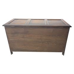 17th century design panelled oak blanket chest, hinged top above carved triple arch frieze, raised on individual carved claw feet
