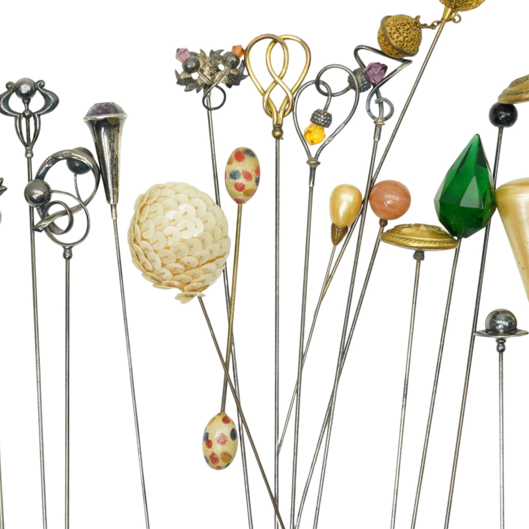 Collection of early 20th century and later hat pins including six silver mounted examples by Charles Horner, pique work, faceted class, jet acorn, filigree etc