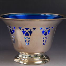 American silver sugar bowl, of circular form with fluted rim and fluted sides, upon stepped circular foot, stamped Sterling by Roden, with blue glass liner