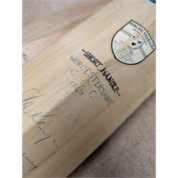 Two signed cricket bats, with signatures including Colin Cowdrey