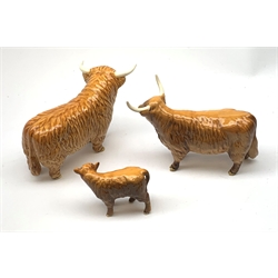 A Beswick Highland Bull, Highland Cow, and Highland Calf, each with printed mark beneath. 
