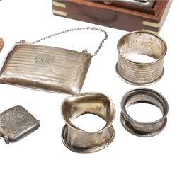 Collection of silver items including purse, three napkin rings, two vesta cases, silver cheroot holder case etc