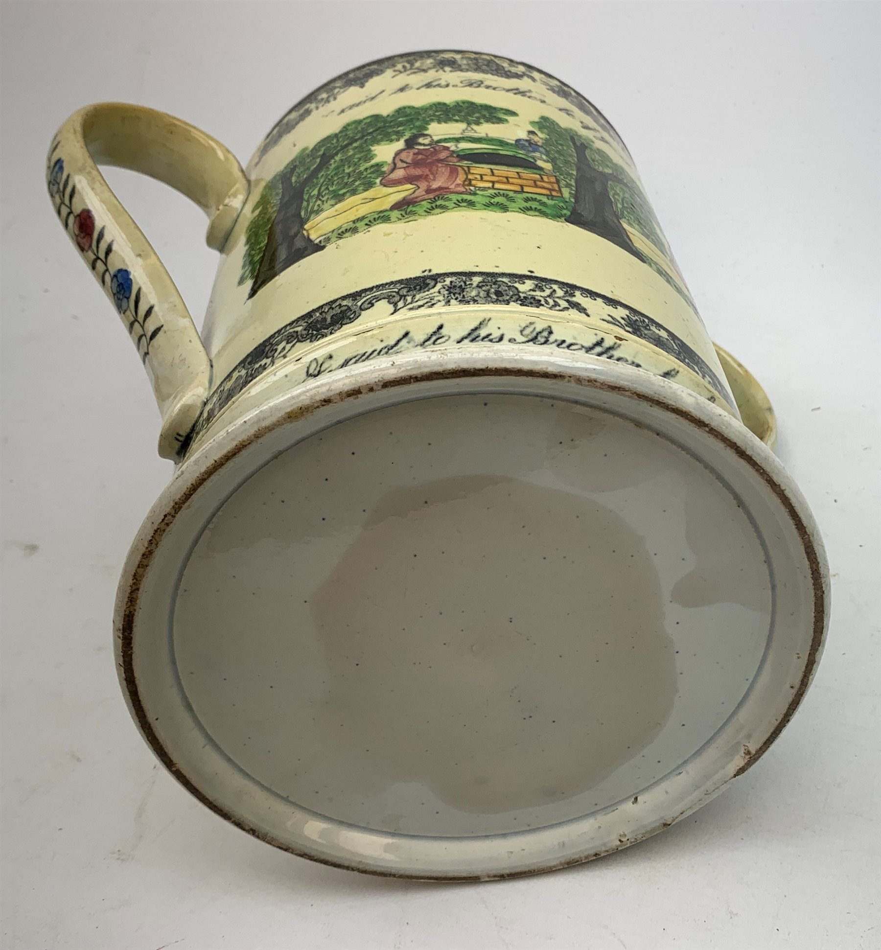 A large 19th century Staffordshire loving cup, detailed 'The Real Cabinet of Friendship Justice and Equity' (a/f), H22cm, together with a pair of 19th century Staffordshire dalmatians, upon oval blue bases, H13cm, a Dresden ewer hand painted with floral sprays, with mark beneath, H15.5cm, and a Coalbrookdale style floral encrusted vase and cover, H16.5cm. 