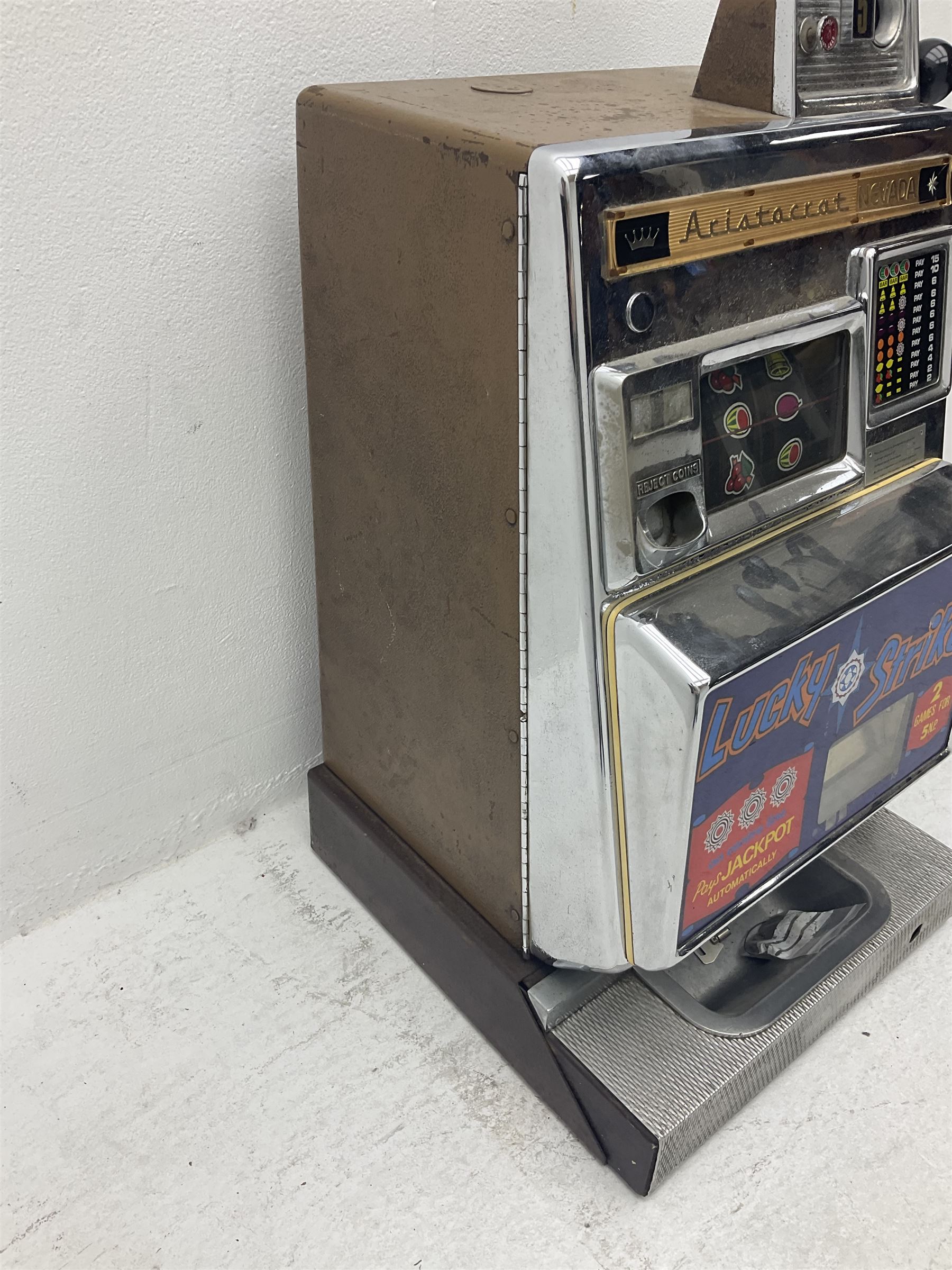 Aristocrat Nevada Lucky Strike one-armed bandit arcade machine, circa 1964, light-up display in aluminium and stainless steel case, with keys, H72cm 