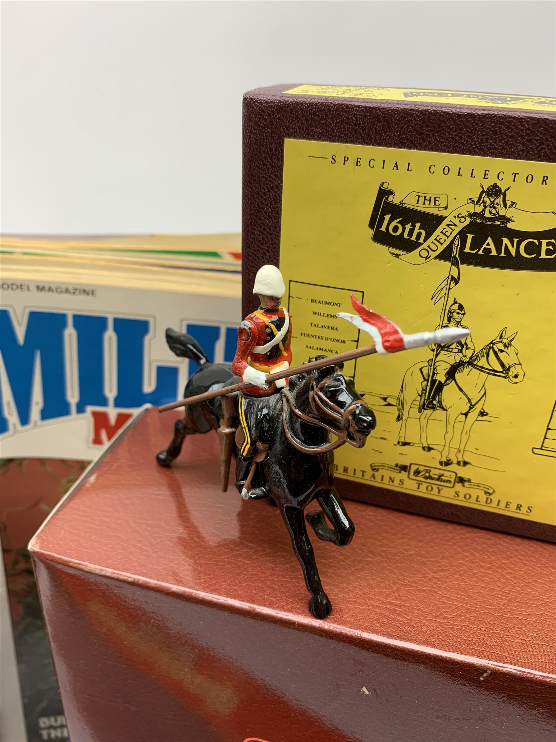 Britains - four Trooping the Colour sets 40109, 40110, 40112 & 40113; The Duke of Wellington with 95th Rifleman No.41160; and 8819 Lancer figure from the 16th Queens Lancers; all mint and boxed; together with a quantity of unboxed figures etc; and collection of books and magazines on model soldiers