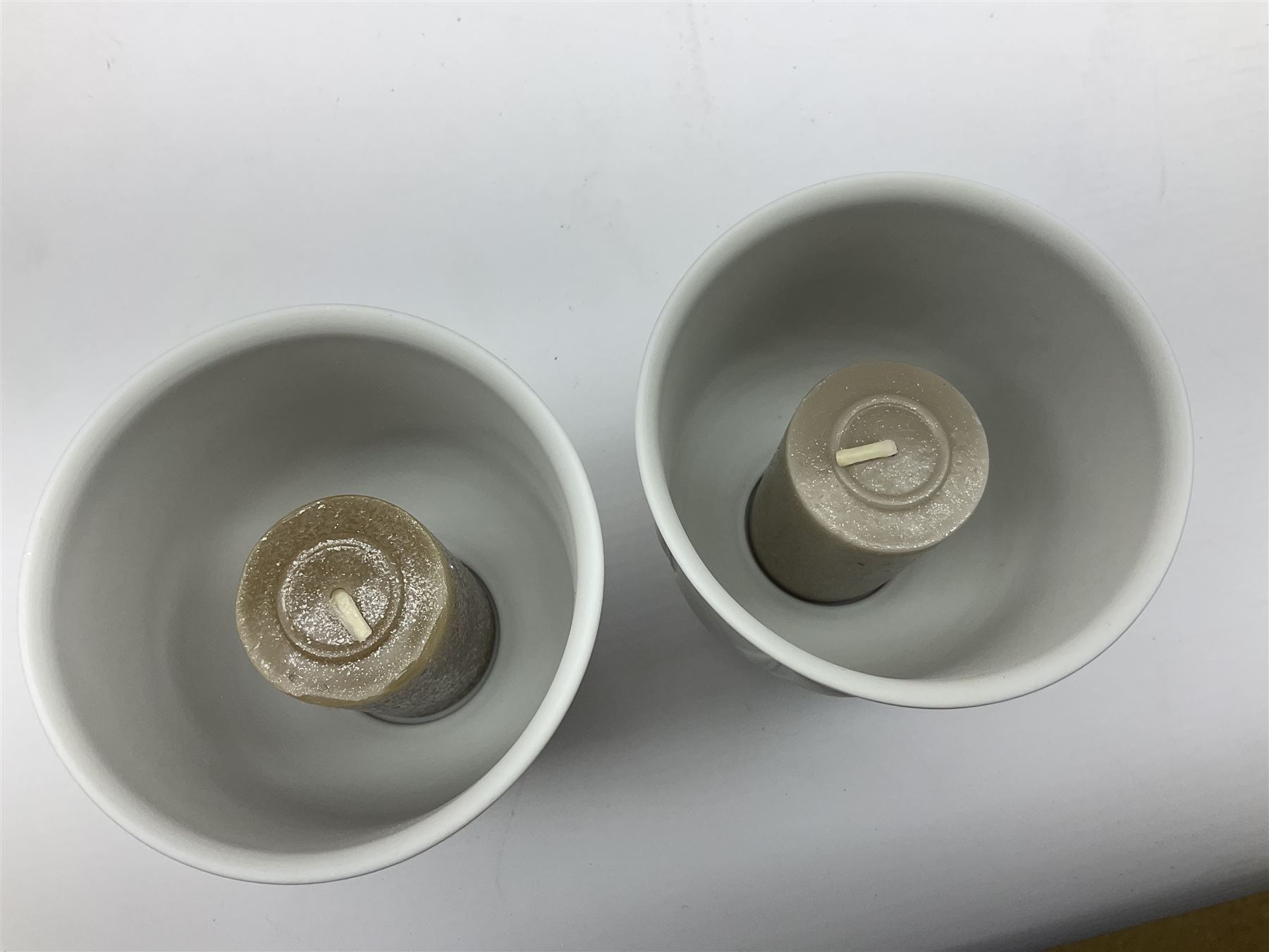 Lladro Collectors Society items, comprising of The Will to Create book, two candle holders; Sailing the Sea no 17665, Dolphins at Play no 17666, Plaque Bringing Us Together, key fob, leather wallet and a members joining pack with plaque, all in original boxes  