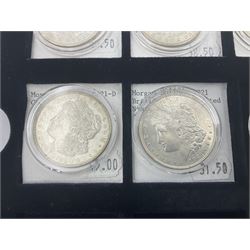 Seven United States of America silver Morgan dollar coins, dated 1884, 1901 O, 1902 O, 1903, 1904 O, 1921 D and 1921