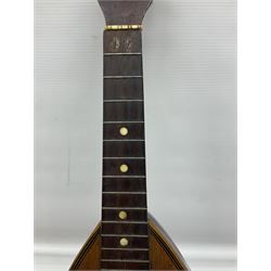 Late 19th century Italian lute back mandolin with segmented bowl back, bears label Gennaro Maglioni Napoli L61cm; in ebonised wooden case; together with another similar damaged Italian lute back mandolin for restoration or spares (2)