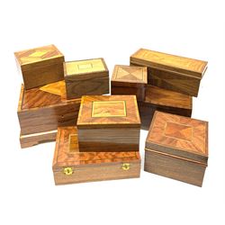A group of modern veneered boxes, of various form with harlequin inlay including mahogany and walnut, largest H12.5cm, plus a similar stand. (9).