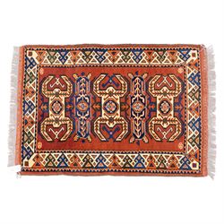 Two rugs, small Bokhara-type rug, terracotta ground with repeating hooked lozenge medallions enclosed by geometric borders (H 120cm, W 83cm); and a cream-ground rug, central lozenge medallion with geometric spandrels and border motifs (H 145cm, W 101cm),
