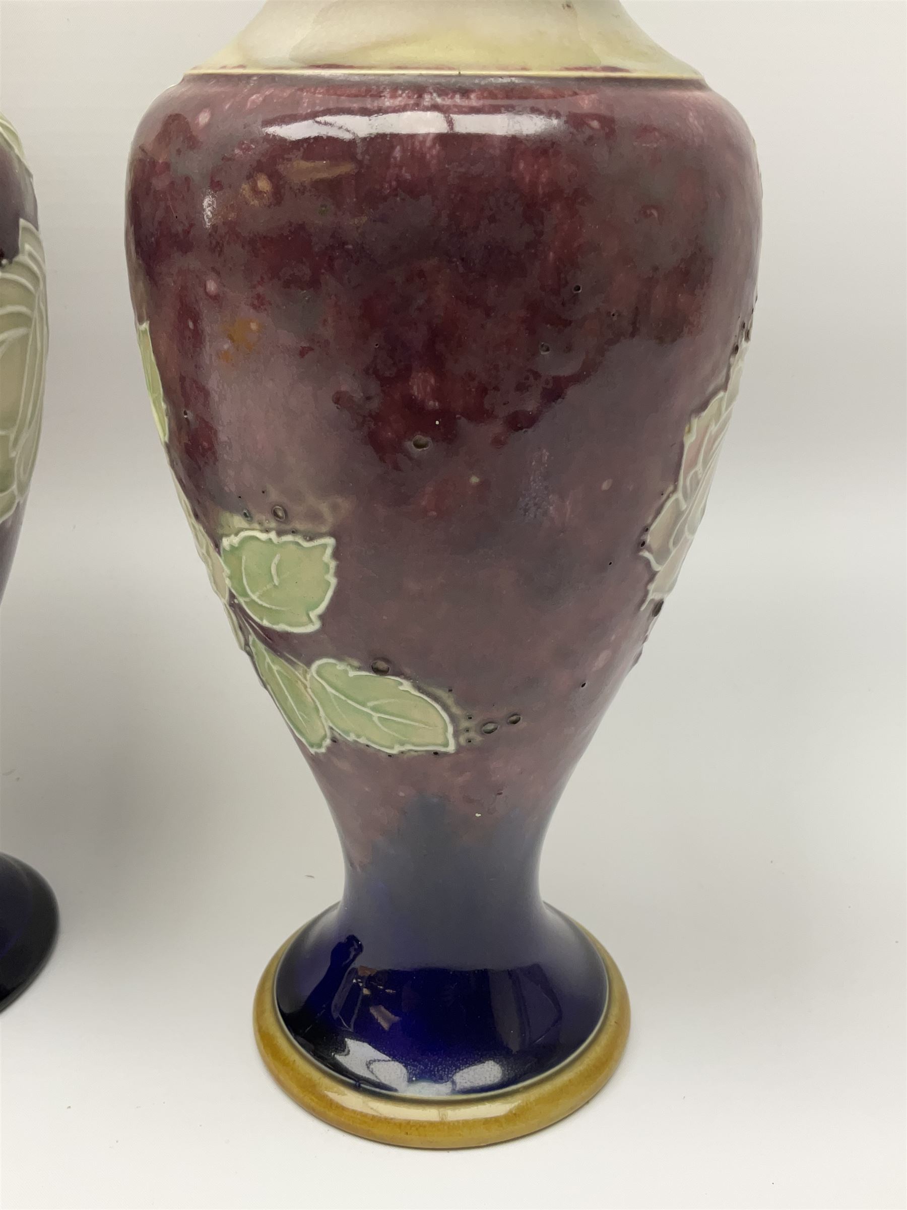 A pair of early 20th century Royal Doulton stoneware vases, of baluster