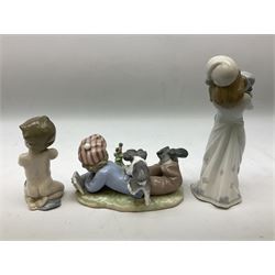 Three Lladro figures, comprising 'Study Buddies' no. 5451, 'A Child's Prayer' no. 6496 and 'Going to Bed' no. 8019, tallest H21cm