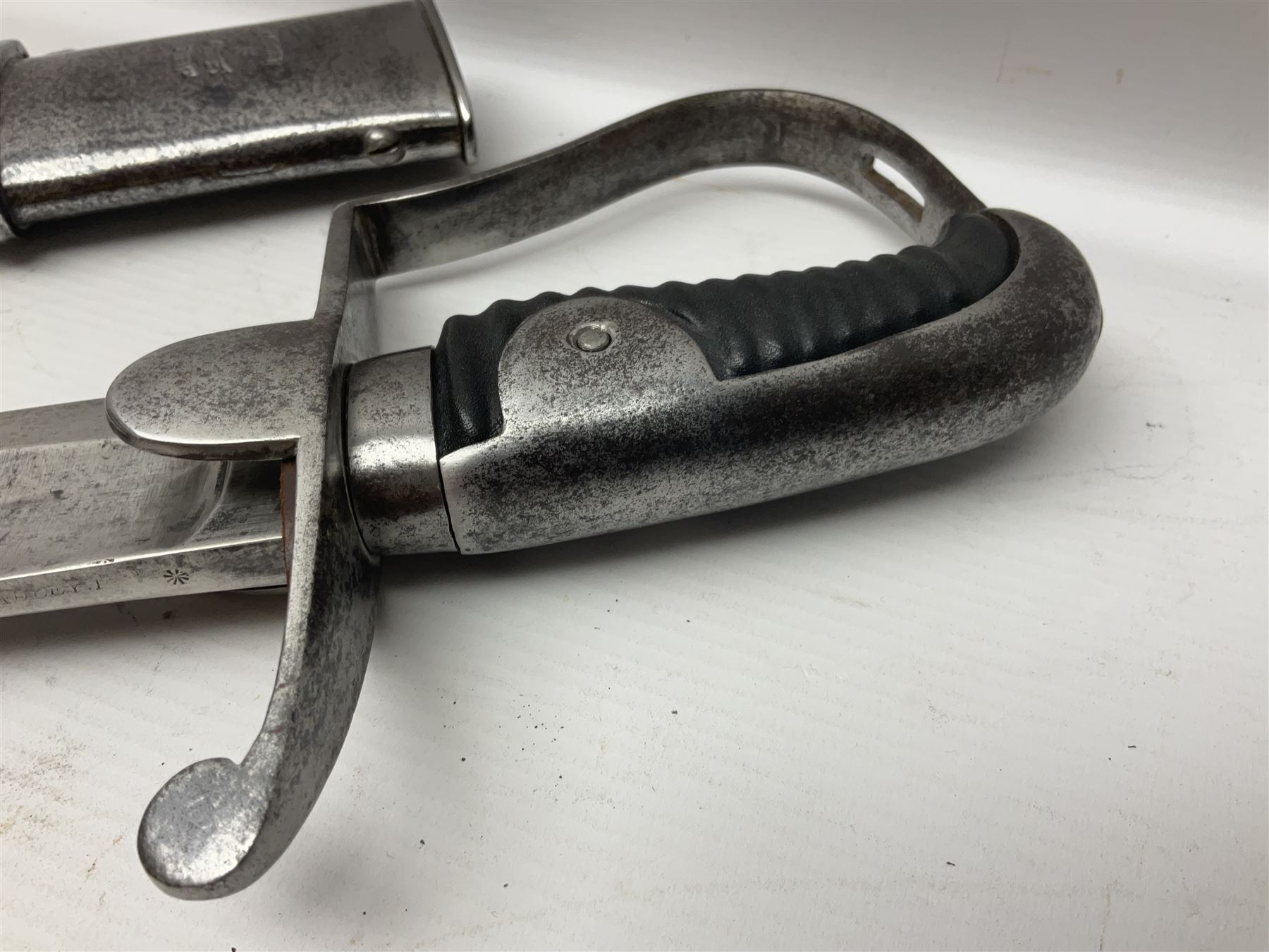 British 1796 Pattern Light Cavalry trooper's sword, the 84cm curving fullered blade stamped Hadley.1 to the back edge, steel hilt with knucklebow, D-shaped langets and leather grip; in polished steel scabbard stamped Osborn & Gunby Birmm. and W.R.16 ( ?16th Light Dragoons) with two suspension rings L100cm overall