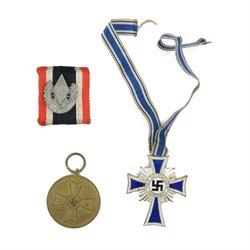 German Cross Of Honour Of The German Mother silver with ribbon, together with War Merit Medal 'fur kriegs verdien 1939' and Hitler youth badge