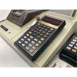 Four 1970s Sinclair electronic calculators - Cambridge in hard case with booklet; Scientific Programmable with Program Library and booklet; Scientific in hard case; and Oxford 300 in soft case with booklet; together with Texas PC-100 SR56 programmable slide-rule calculator on base station with readout, two booklets, keys and cover, serial no.9103093