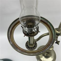 William H Honey polished brass adjustable student's oil lamp, with green glass shade, H60cm