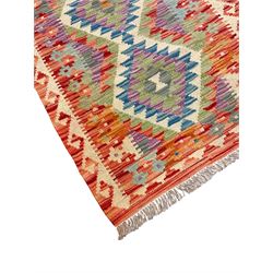 Chobi Kilim red ground and multi-coloured runner, decorated with overall geometric design, trailing lozenges within hooked border