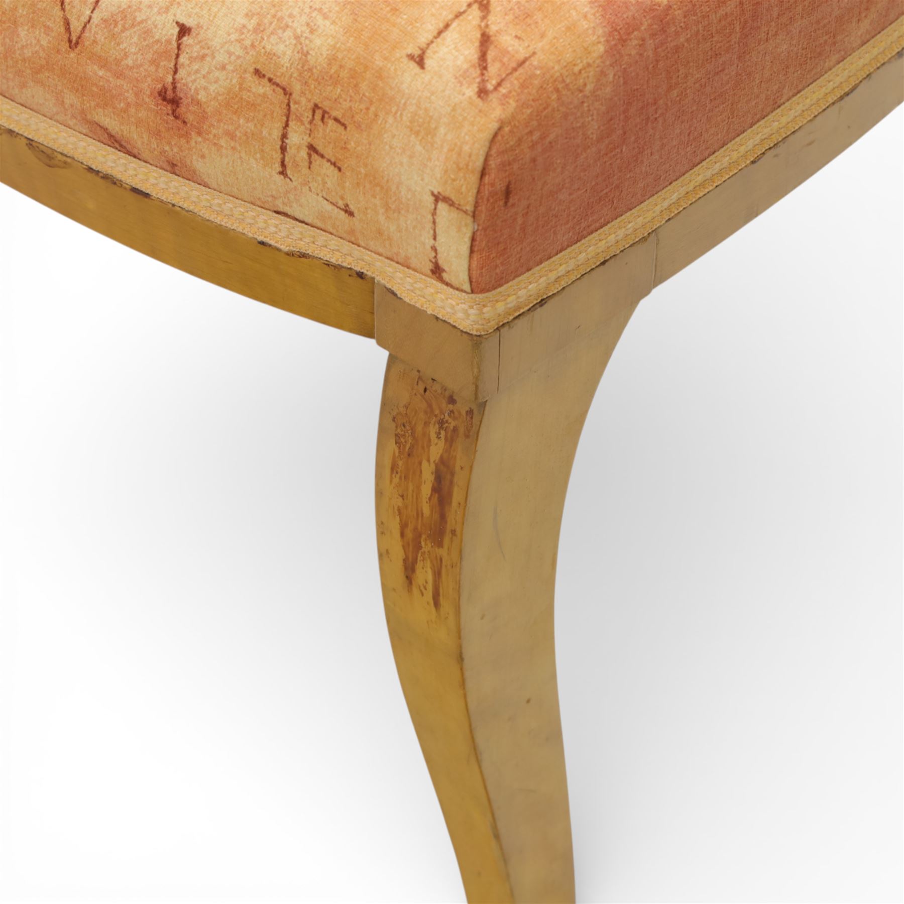 Edwardian pair of satinwood side chairs, each with shaped crest rail above an intertwining oval pierced splats centred by a floral patera, upholstered drop-in seats, raised on cabriole supports with applied floral mounts to the knees