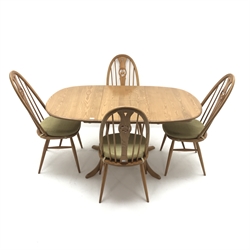 Ercol Chester elm extending pedestal dining table, turned column on four shaped supports (W148cm, H73cm, D90cm) and set four elm swan high back dining chairs (W48cm) and a Windsor swept back chair