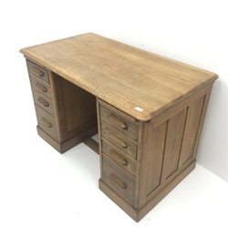  Vintage oak twin pedestal desk, two slides, eight drawers, plinth base, W122cm, H78cm, D68cm  