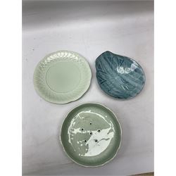 Clarice Cliff salad drainer and stand, moulded in relief with leaves and flowers on celadon ground, both with printed mark in green beneath, together with a studio pottery dish by Dennis Lucas, largest D22cm