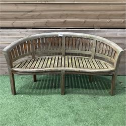 Teak serpentine curved garden bench - THIS LOT IS TO BE COLLECTED BY APPOINTMENT FROM DUGGLEBY STORAGE, GREAT HILL, EASTFIELD, SCARBOROUGH, YO11 3TX