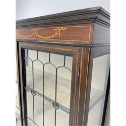 Edwardian inlaid mahogany display cabinet, two lead glazed doors enclosing two lined shelves, square tapering supports on spade feet
