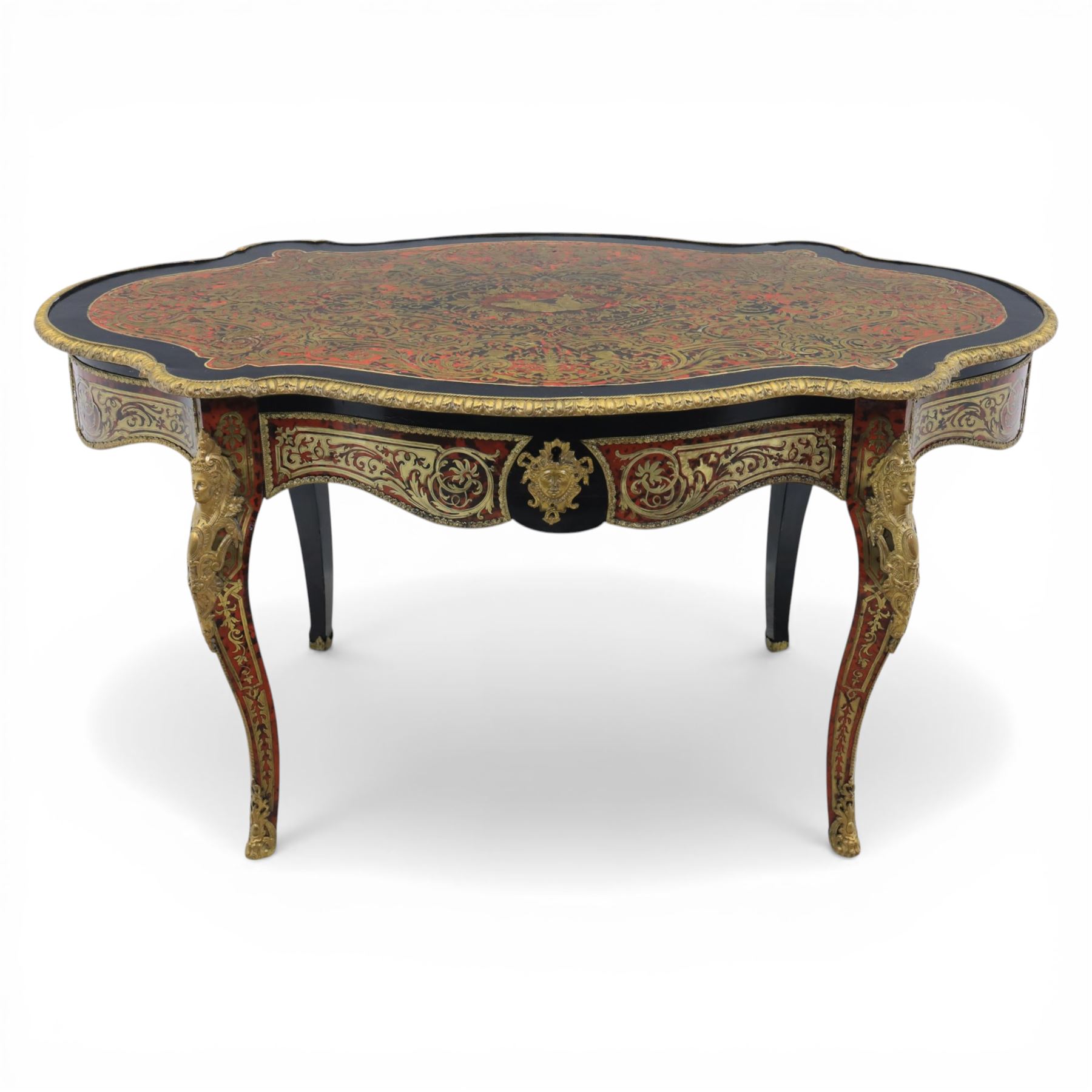 Late 19th century boulle work centre table, shaped serpentine top decorated with brass inlay on red tortoiseshell ground within ebonised border, fitted with single frieze drawer, on cabriole supports with gilt metal mounts and mask terminals