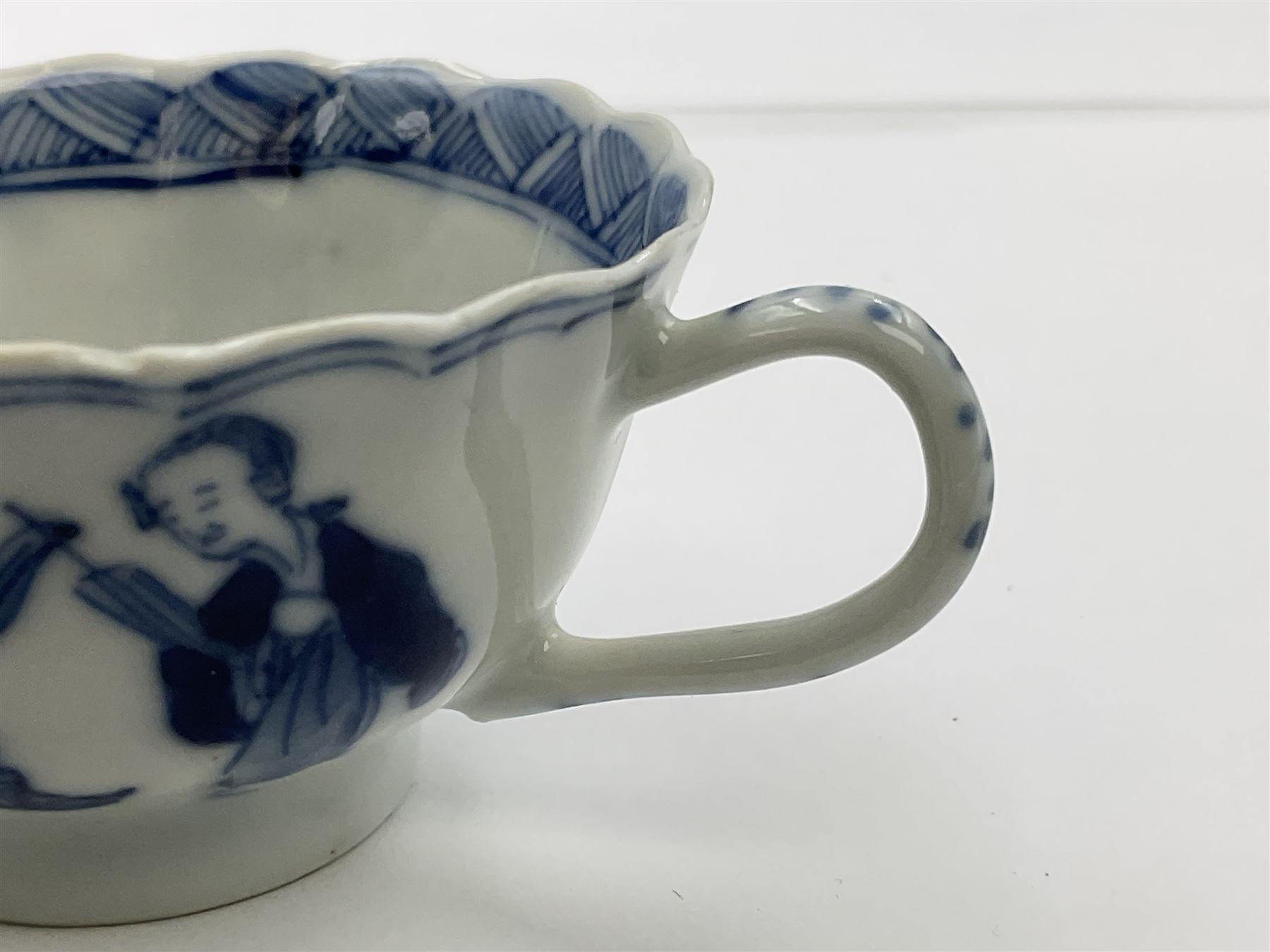 18th century Chinese blue and white Kangxi teacup and saucer, decorated with dancing figures, four character Kangxi mark beneath, saucer D10cm