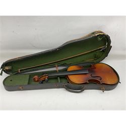 Czechoslovakian violin c1920 with 36cm two-piece maple back and ribs and spruce top, bears label 'Copy of Antonius Stradivarius Made in Czechoslovakia' L59cm; in carrying case; 1950s Czechoslovakian violin; and 195os Czechoslovakian three-quarter size violin; both cased (3)