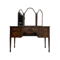 Early 20th century bow front mahogany dressing table, triple mirror back over five drawers, square tapering supports with spade feet