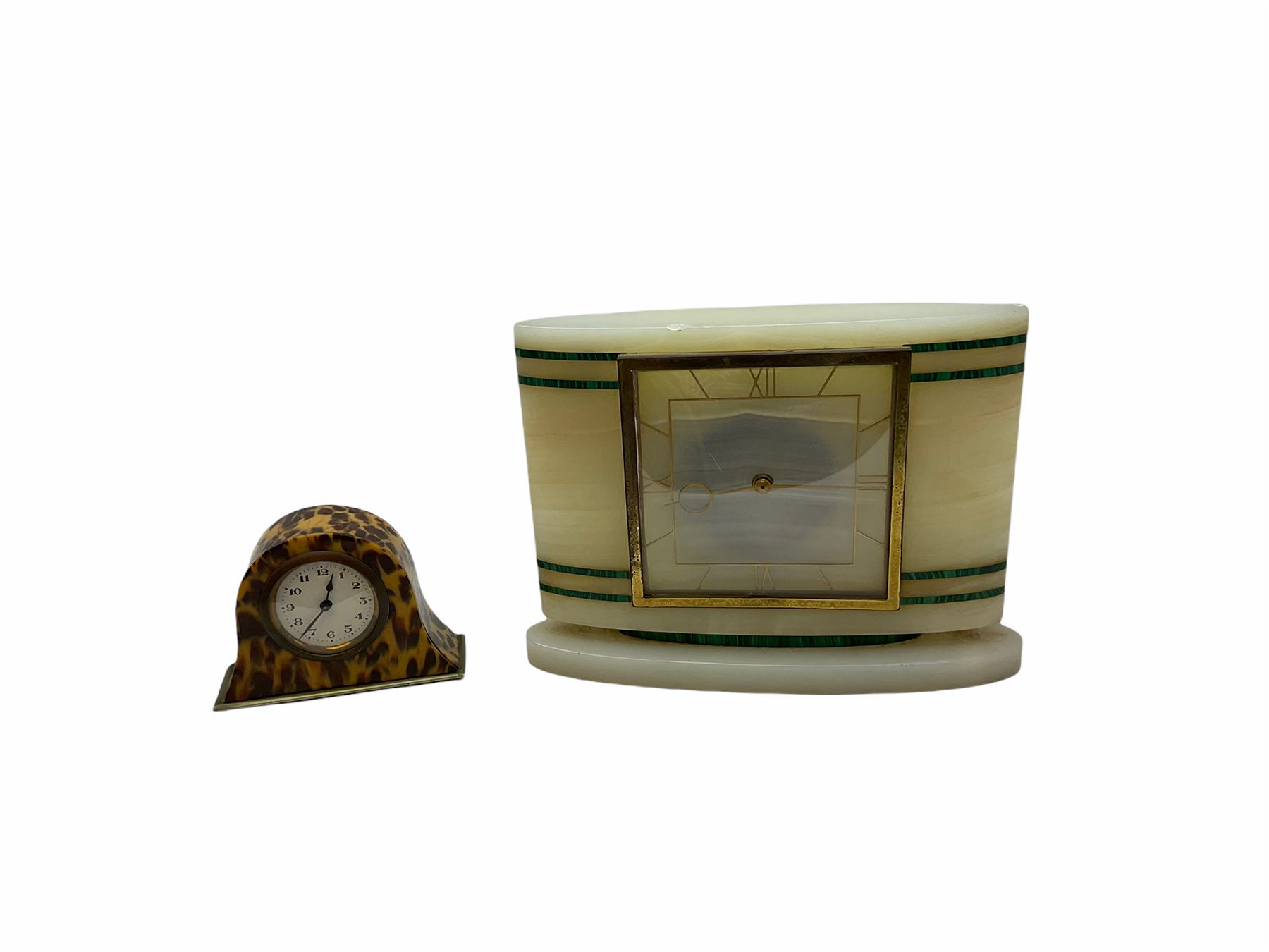 Smiths Industries SEC mains electric driven mantle clock in a rectangular Art Deco alabaster case inlaid with contrasting horizontal malachite inlay to the front, 4-1/2” square dial with brass roman numerals at 12, 3 , 6 and 9 and baton hands, with a square brass bezel and flat glass. Wiring untested, sold as a decorative item.
H 19 cm W 25 cm D 7 cm
With a small eight-day table clock in a faux tortoise shell case on a silver-plated base, 2” white dial with Arabic numerals and minute markers, steel spade hands, balance wheel movement with integral winding key. 
H 9.5 cm W 12 cm D 4 cm
