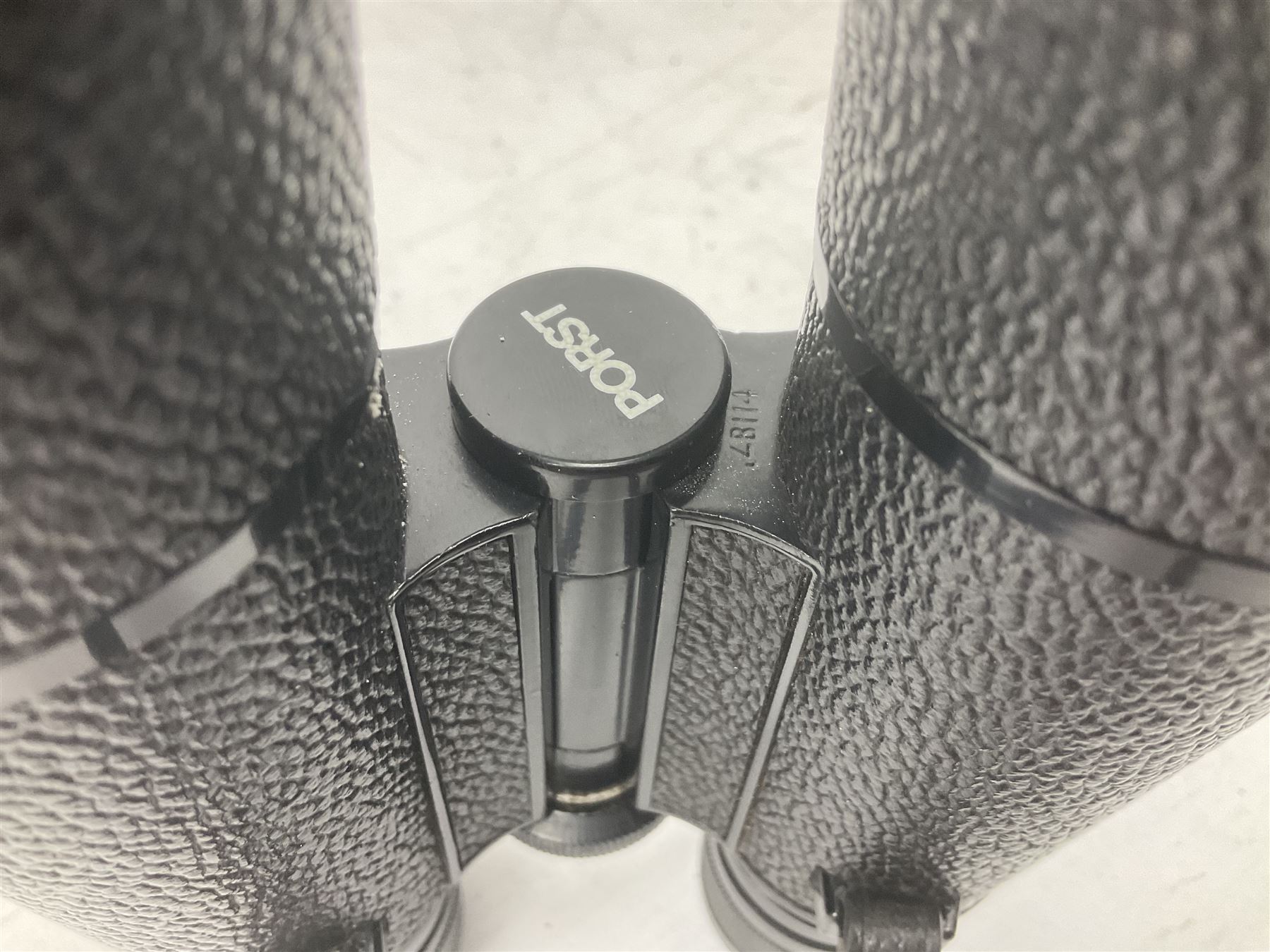 Nine cased pairs of binoculars to include Lieberman & Gortz 12x50, Frank Nipole 8x56, Uniscope, Hoya mark II 8x40, Porst 8x56 etc