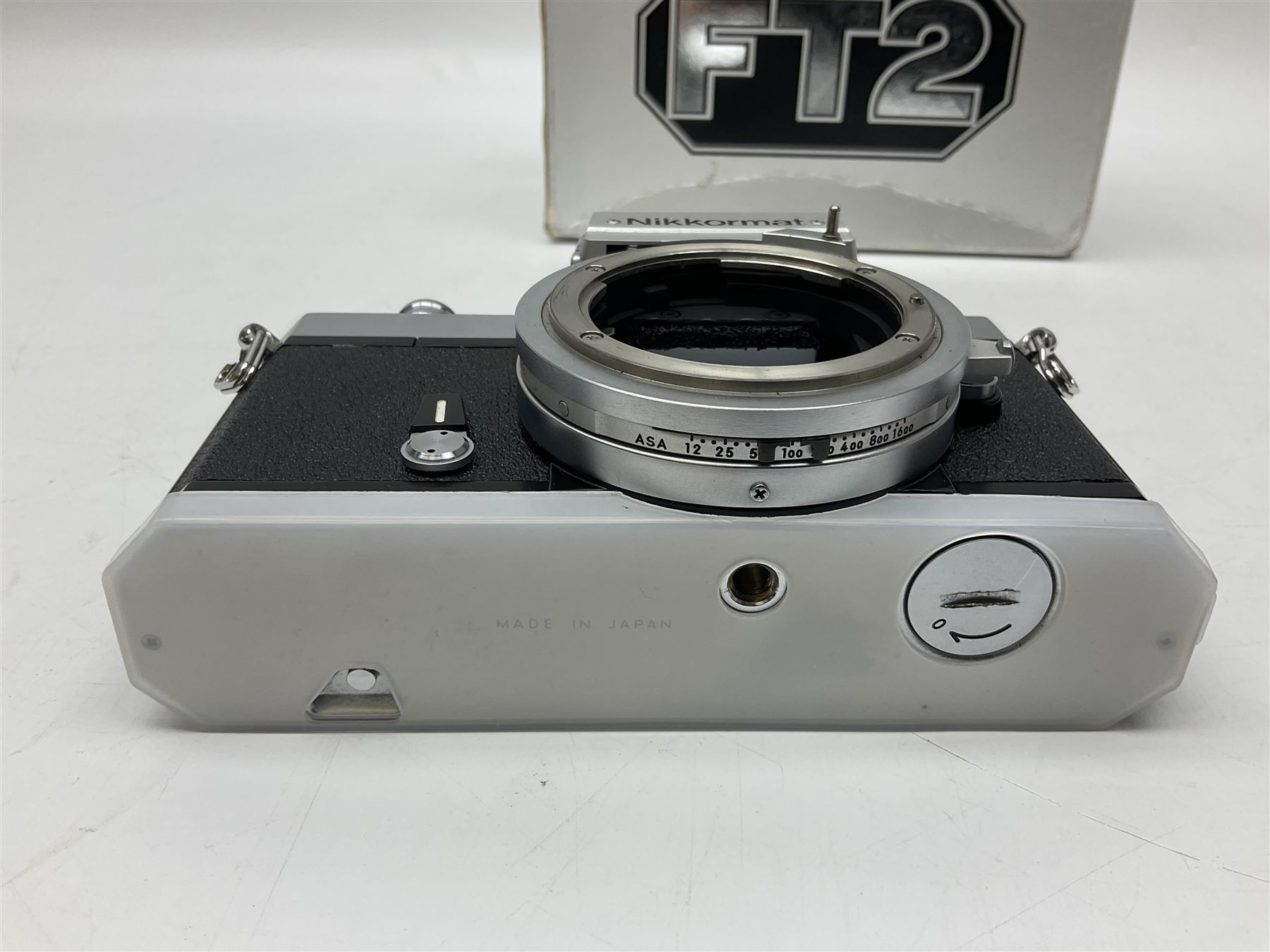 Nikkormat FT2 camera body, serial no. 5066813, in original packaging, together with Nikkormat EL camera body, serial no. 5577358, with Nikon Nikkor 50mm 1:1.8' lens no. 2143575, Nikkormat FT, serial no. 3968385, and Nikomat FT camera body, serial no. 4015491