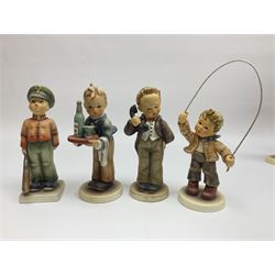 Thirty Hummel figures by Goebel, to include Saluting the Peacekeepers of Operation Joint Endeavor, on wooden plinth, Call to Glory, Celebrate with Song and Soldier Boy