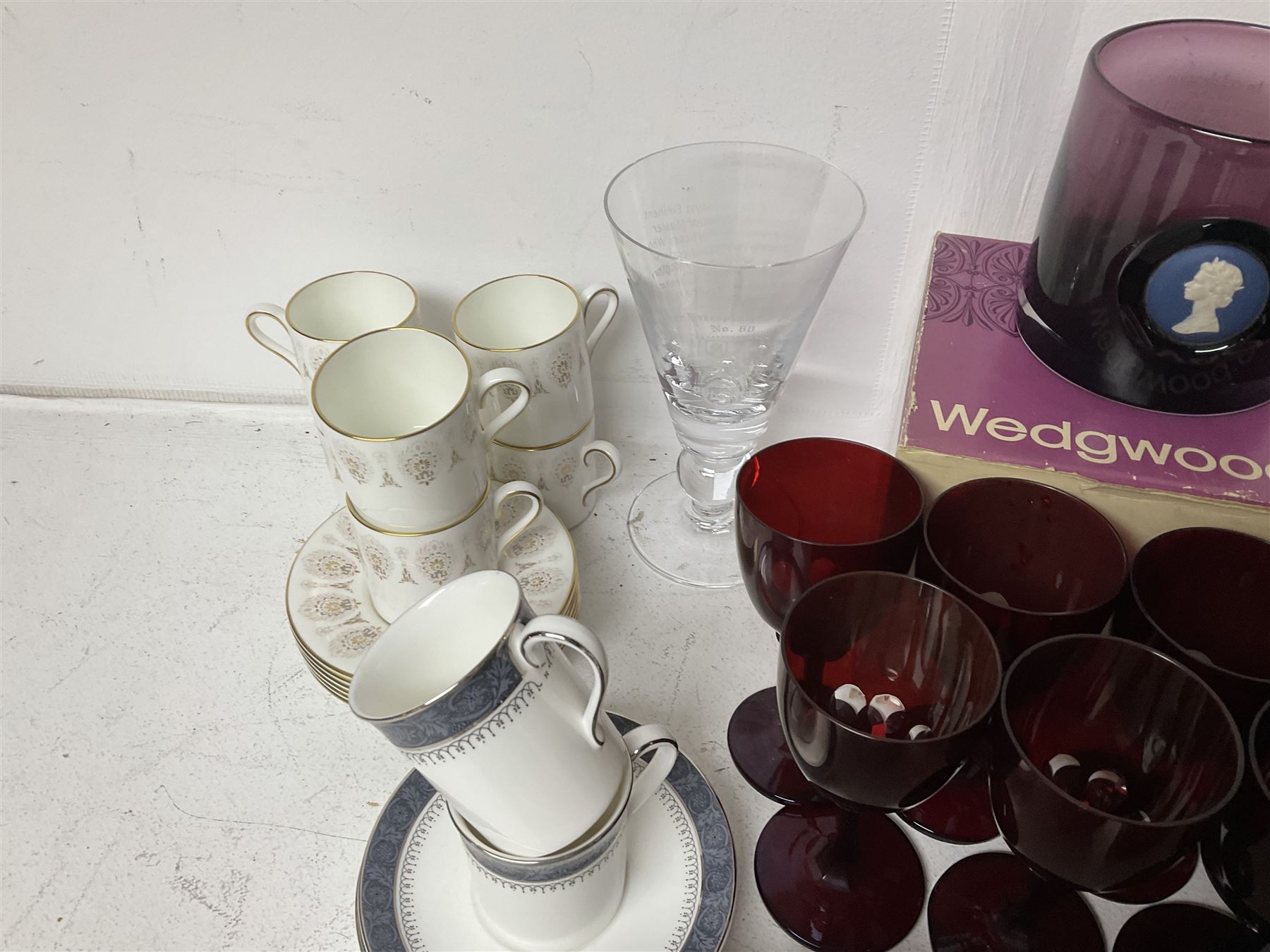 Twin handled sucrier with cover, in the manner of Thomas Grainger for Royal Worcester, together with Wedgwood Medina pattern coffee cans and saucers, a set of ten ruby glasses and a Wedgwood cameo glass tankard etc