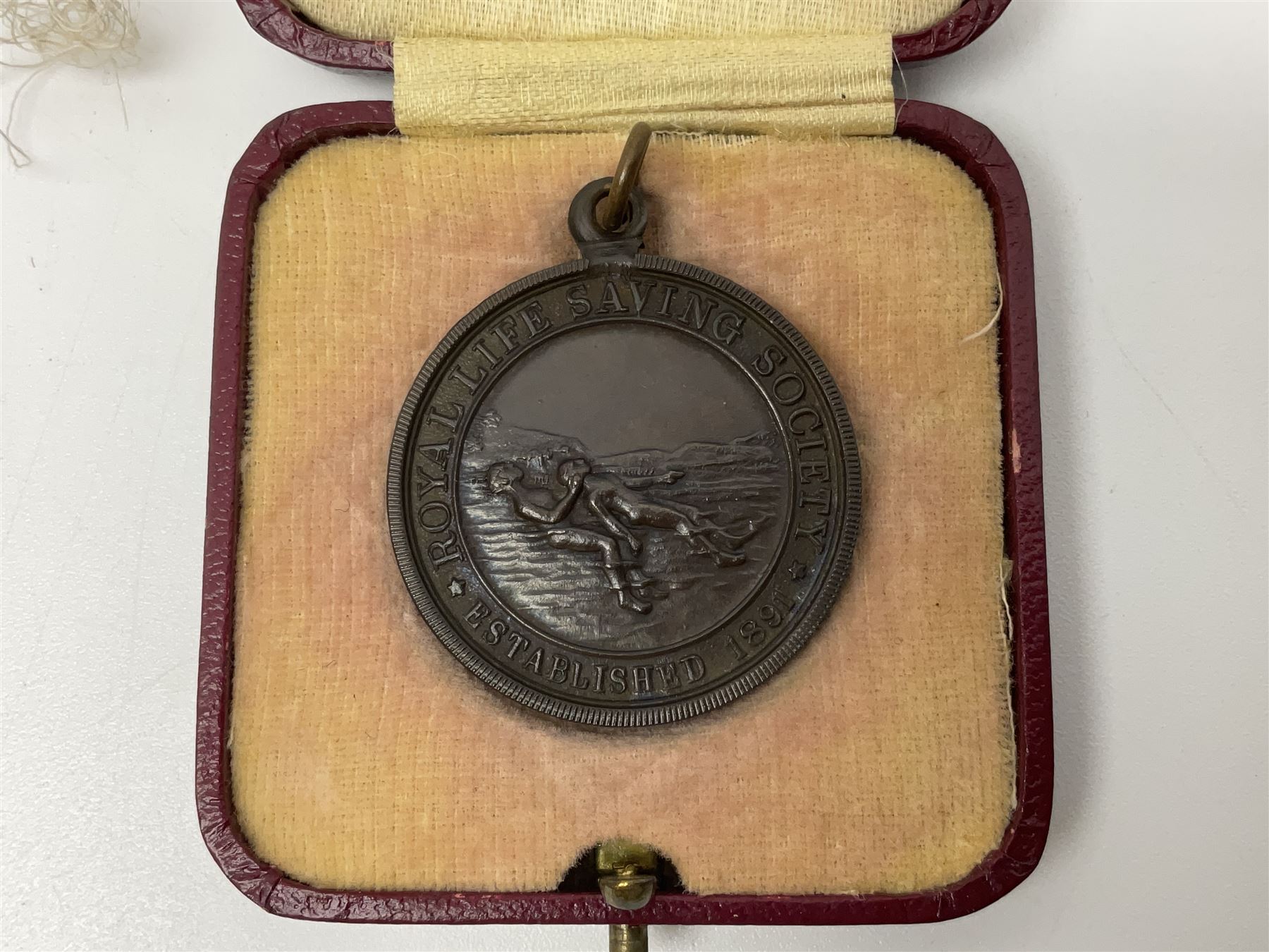 Collection of WW2 and police medals c.1933-1955, awarded to Eric Drinkwater comprising 1939-45 War Medal, Defence Medal, 1939-45 Star and Burma Star, on wearing bar; 1918-62 General Service Medal with Cyprus clasp to P.S. E.G. Drinkwater; boxed; Police Long Service and Good Conduct Medal to Const. Eric C. Drinkwater; cased; Royal Life Saving Society bronze medal to E.C. Drinkwater July 1933; boxed; and George V 1937 coronation medallion; boxed.