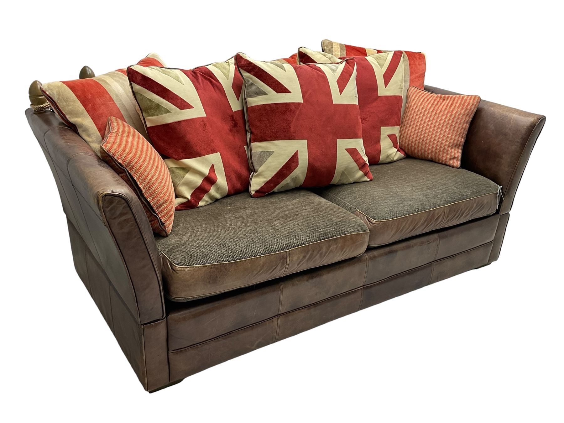 Large Knole design three-seat sofa upholstered in brown leather with scatter cushions upholstered in contrasting striped and Union Jack patterned fabric, on block feet (W210cm, H100cm, D102cm); together with matching rectangular footstool (135cm x 75cm, H45cm)