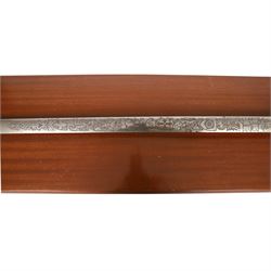 Wilkinson Sword, with 76cm double edge blade, etched with makers name and decoration, wooden grip, brass guard and hilt, together with another sword
