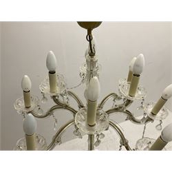 Victorian style glass eight branch chandelier, with drip trays, brass tone support, and drops