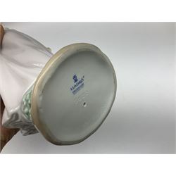 Three Lladro figures, comprising, Dreams of Summer Past no 6401, Spring Breeze no 4936 and Breezy Afternoon 5682 together with Lladro plaque Art Brings us Together no 7677, all in original boxes, largest example H35cm