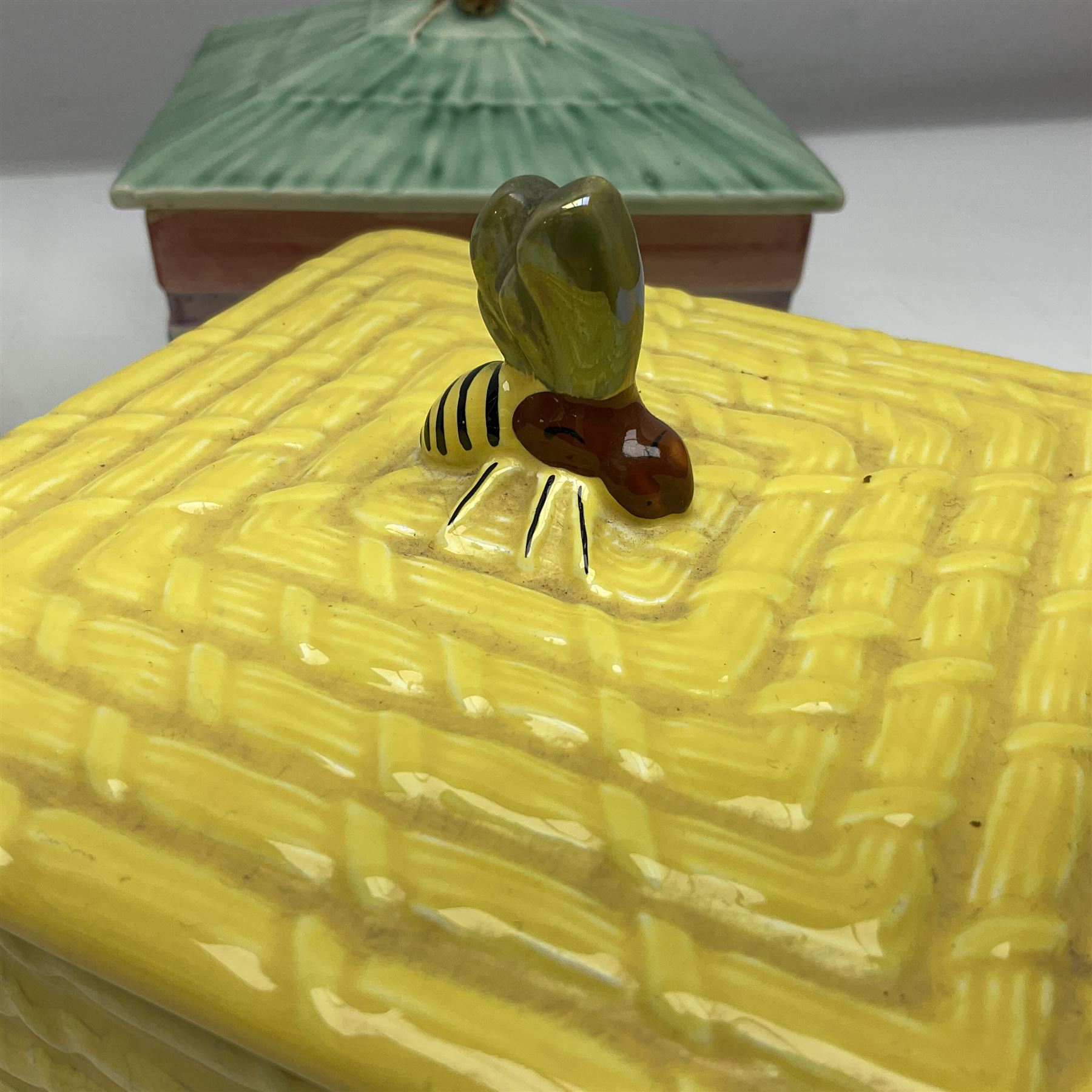 Clarice Cliff for Wilkinson Ltd Crocus Bizarre beehive honeypot painted in the Crocus pattern, together with two beehive Beswick honey pots, Poole square honey pot etc (14)