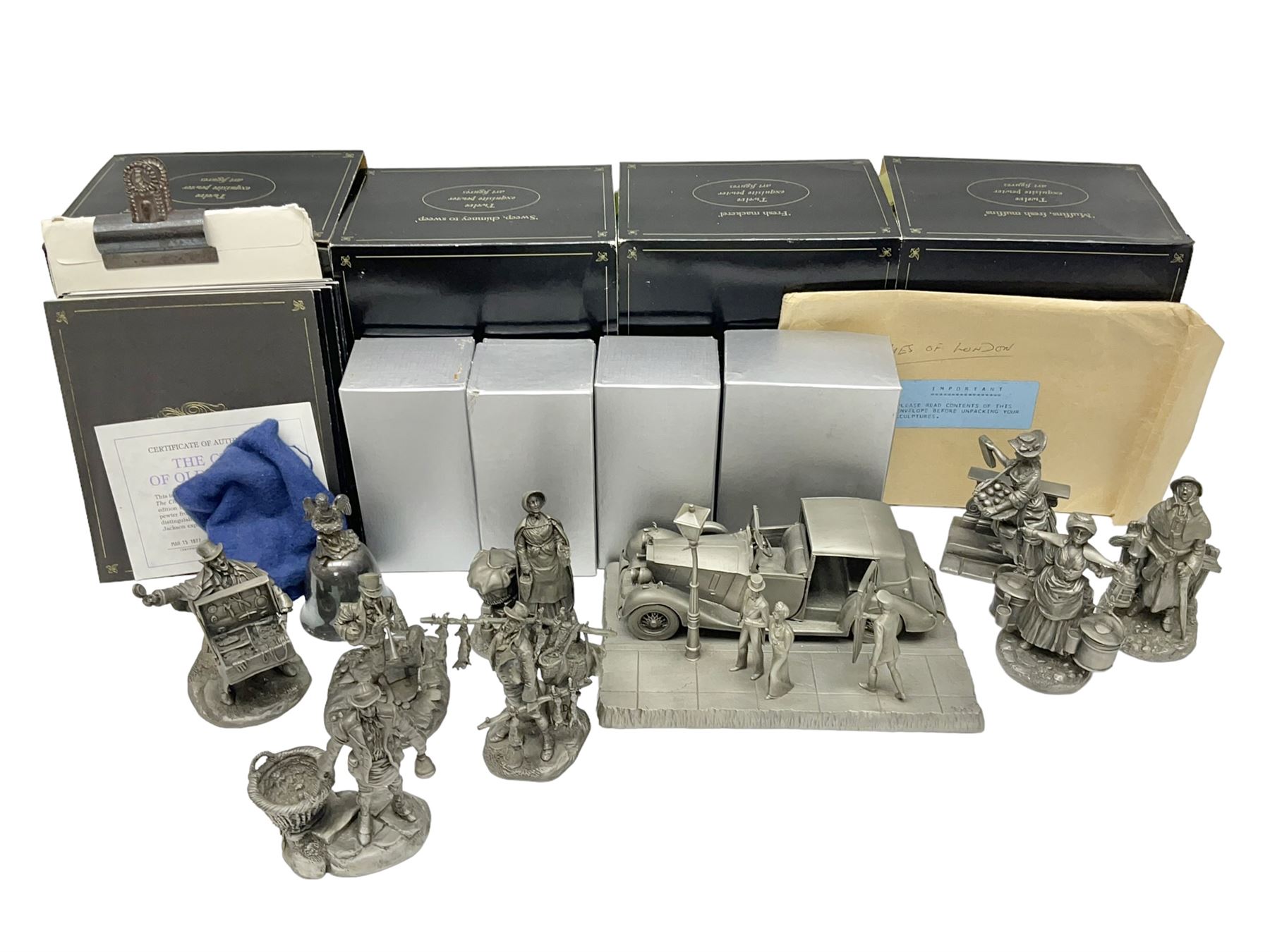 Twelve Franklin Mint pewter figures, to include some from the Cries of London series, together with a Franklin Mint 1937 Rolls Royce Phantom III pewter model and Danbury Mint Christmas bells